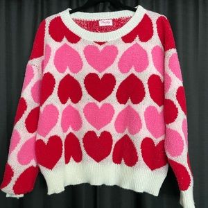 Pink Lily heart sweater. Never worn. Too short for me!